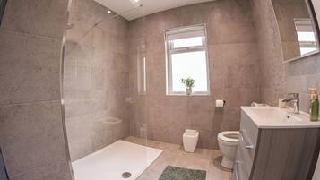 Shower, hair dryer, towels, soap