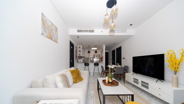 Living area - 2-bedroom ensuites,  apartment in charming Dubai with fitness room, AC, WiFi (Dubai south)