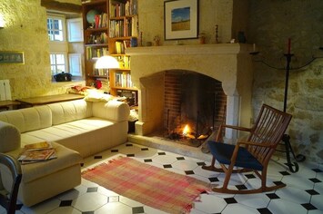 Dine beside the cosy fireplace, vintage stereo system and library at your elbow!