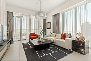 Appartement Deluxe | Coin séjour | TV connectée de 50 pouces avec chaînes numériques