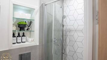 Shower, hair dryer, towels, soap