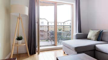 Apartment, Balcony | Living area | 32-inch flat-screen TV with cable channels, Netflix, streaming services