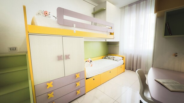 A bunk bed with a desk and chair, a bed with a floral pillow, and a window with curtains. - Casa Perini in Chioggia (Chioggia)