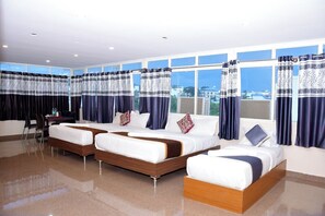 Family Quadruple Room, City View | Memory foam beds, individually furnished, free WiFi