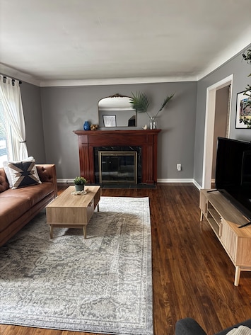 Living Room with Couch, Chair, and Roku Smart TV