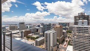 A high-rise urban cityscape with modern buildings and a clear sky. - 16 On Bree Superior Apartment (Cape Town)