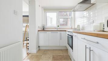 Apartment | Private kitchen | Full-size fridge, microwave, oven, stovetop