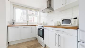 Apartment | Private kitchen | Full-size fridge, microwave, oven, stovetop