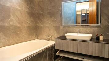 Shower, jetted bath, towels, soap