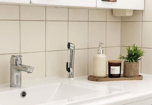 Bidet, towels, soap, toilet paper