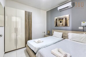 2 bedrooms, desk, iron/ironing board, travel cot