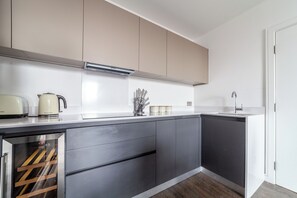 Apartment, Balcony | Private kitchen | Full-size fridge, microwave, oven, stovetop