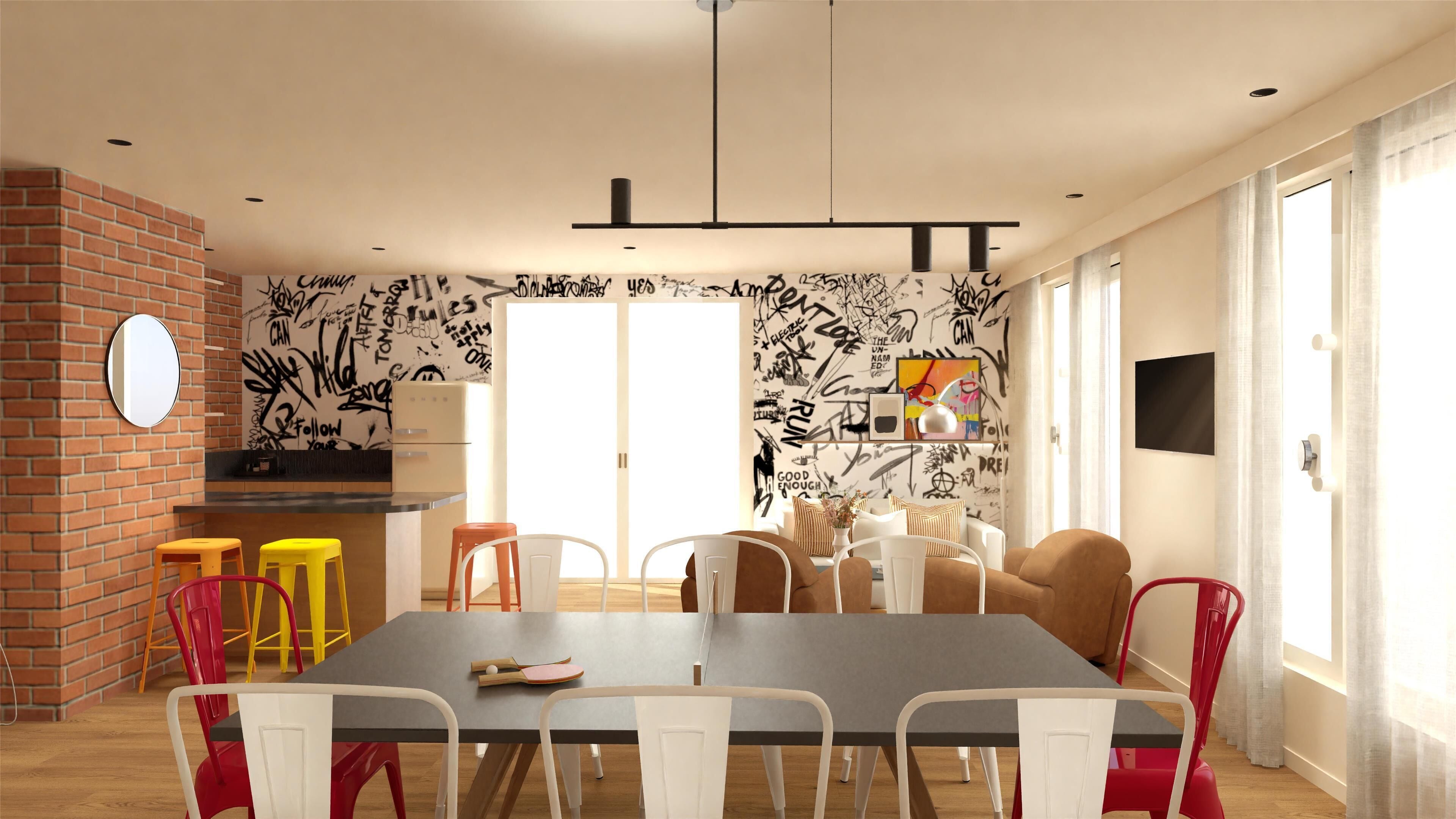 A modern dining area with a brick accent wall, graffiti-style wallpaper, and a mix of colorful and white chairs.