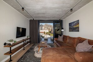 Superior Apartment, Balcony, City View | Living area | TV