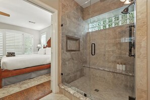 Shower, hair dryer, towels, shampoo