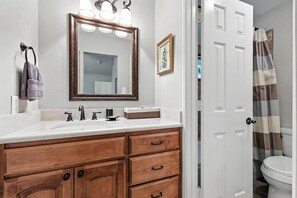 Shower, hair dryer, towels, shampoo
