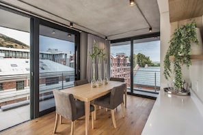 Executive Apartment, Balcony, City View | Dining room