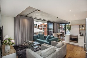 Executive Apartment, Balcony, City View | Living area | TV - The Docklands 2 Bed Executive Apartment (Cape Town)