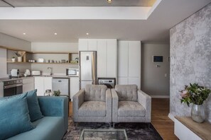 Executive Apartment, Balcony, City View | Living area | TV - The Docklands 2 Bed Executive Apartment (Cape Town)