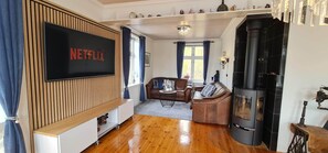 Smart TV, fireplace, DVD player, books