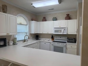 Condo, 2 Bedrooms | Private kitchen | Fridge, oven, coffee/tea maker, toaster