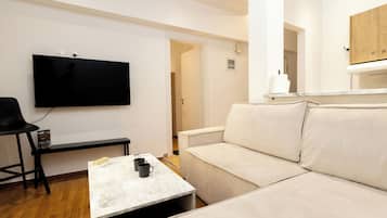 Apartment, 1 Bedroom | Living area | 55-inch Smart TV with digital channels