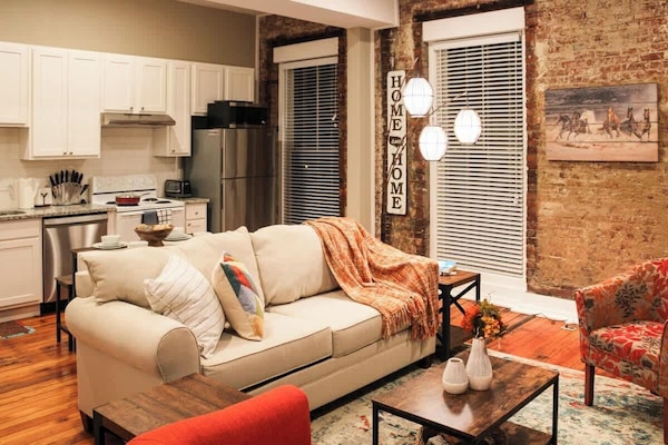 Living room with full kitchen and open layout