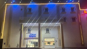 A hotel entrance with a reception area, marked by a sign in Arabic. - Alfursan Almotahida Serviced Apartments Alhamadania Dist Baydon Street (Jeddah)