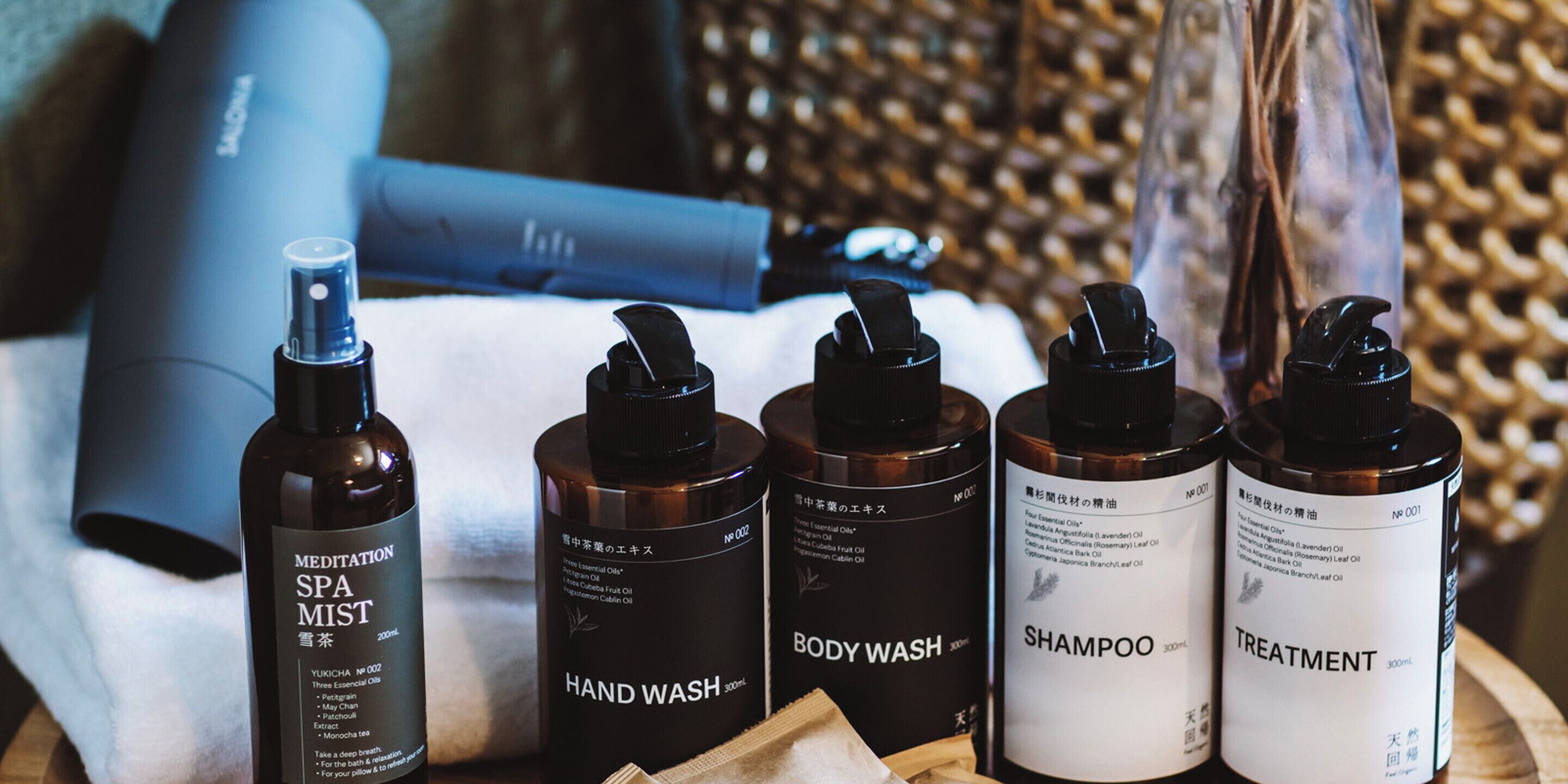 A variety of spa products including a body wash, shampoo, and a hand wash.
