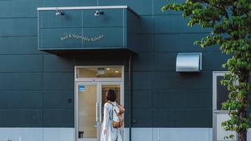 A building with a sign reading 'Bed & Vegetable Kahoku' above the entrance.