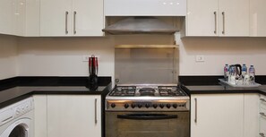 Superior Apartment, 2 Bedrooms | Private kitchen | Full-sized fridge, oven, cookware/dishes/utensils