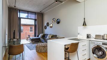 Luxury Apartment, Balcony, City View | Living area | TV