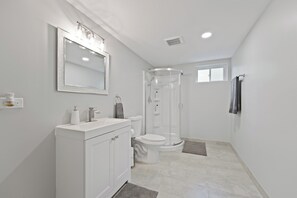 Shower, hair dryer, towels, soap