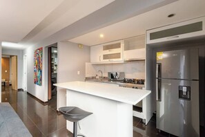 Fridge, microwave, stovetop, coffee/tea maker