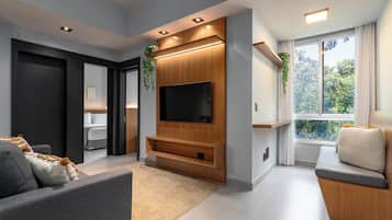Apartamento superior, 2 quartos, ar-condicionado | Área de estar