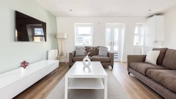 Apartment, Balcony | Living area | 32-inch flat-screen TV with cable channels, Netflix, streaming services