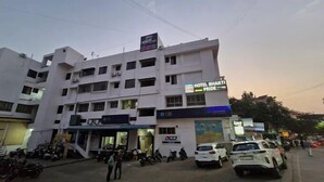 A multi-story building with a sign for 'Hotel Bhakti Pride'. - Hotel Bhakti Pride Nashik (Nashik)