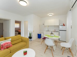 House (Four Bedroom Holiday Home with Terrac) | Living room | 32-inch flat-screen TV with cable channels