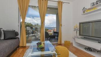 Apartment (One Bedroom Apartment With Balcony An) | Living room | 32-inch flat-screen TV with satellite channels