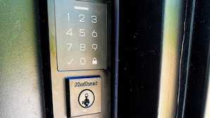 A door with a numeric keypad and a lockset. - Cozy Container, HotTub, King Bed, Pets, Wifi, 1 Night Stays, Griddle, Firepit (Chillicothe)