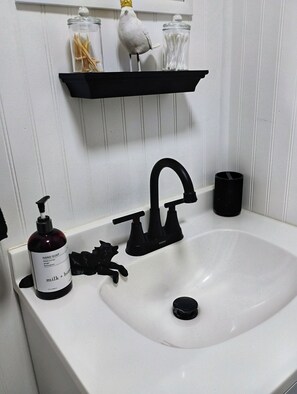 Hair dryer, towels, soap, toilet paper