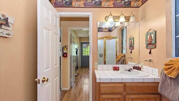 Signature Cabin, 3 Bedrooms, Non Smoking, Patio | Bathroom | Combined shower/tub, towels, toilet paper