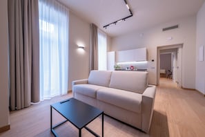 Suite Deluxe, balcón | Zona de estar