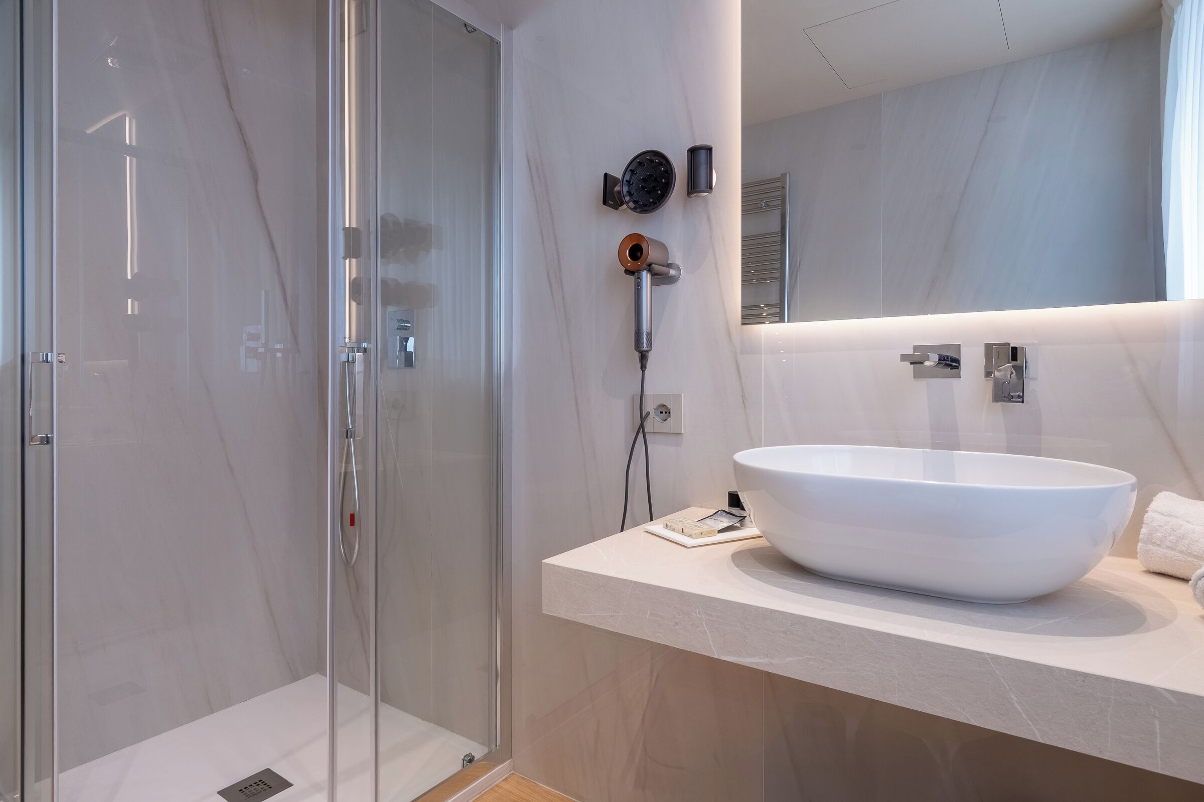 Shower, hair dryer, towels, soap