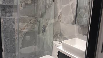 Shower, hair dryer, towels, soap