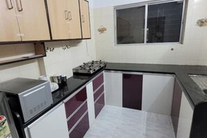 Fridge, microwave, cookware/dishes/utensils