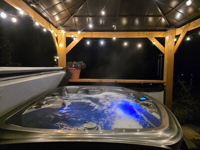 Cozy river cabin with hot tub, great fishing, and peaceful nature views.