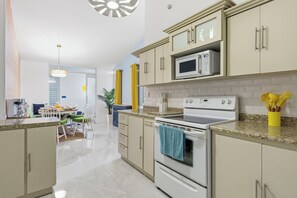 Microwave, oven, stovetop - Retro Resort-Style Home w/ Pool, Theater, Game Room, Mini Golf and & More (Ponce)