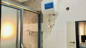 Family Apartment, Balcony, City View | Bathroom | Free toiletries, hair dryer, towels, soap