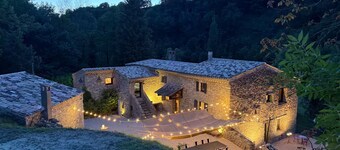 Old mill nestled in greenery in Drôme Provençale, hidden from view